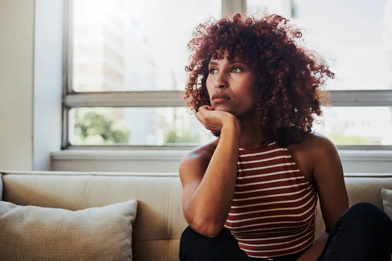 1800x1200 Depressed Woman Sitting On Sofa.jpg