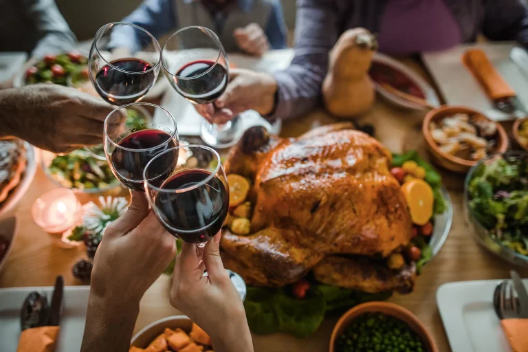 1800x1200 People Toasting With Wine At Thanksgiving Dinner.jpg