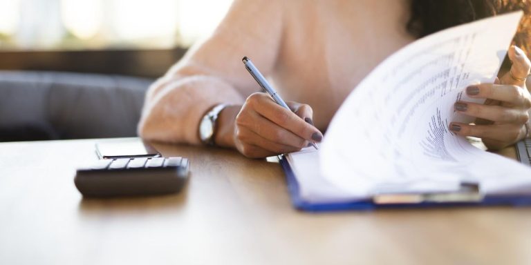 Woman Looking At Insurance Forms.jpg