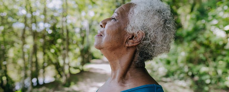 Old Black Woman In Forest.jpg