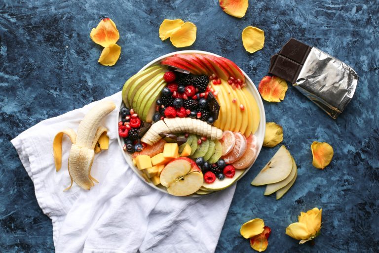 Bowl Of Sliced Fruits On White Textile Scaled.jpg