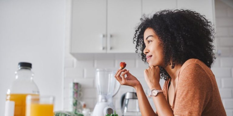 Young Woman Making A Healthy Snack With Fruit At Home.jpg