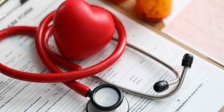 Red Heart And Medical Tool Stethoscope Laying On Health Insurance Claim Form.jpg