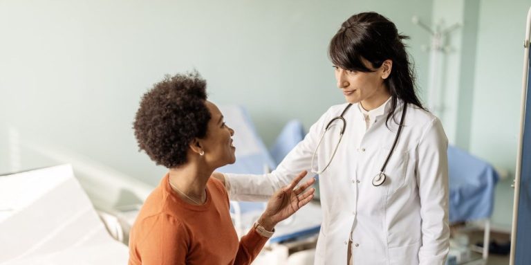 Female Doctor Listening In Comfort During A Consultation Inside Her Office.jpg