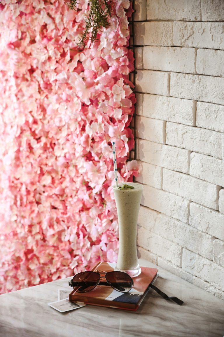 Pink Flowers In Green Ceramic Vase.jpg