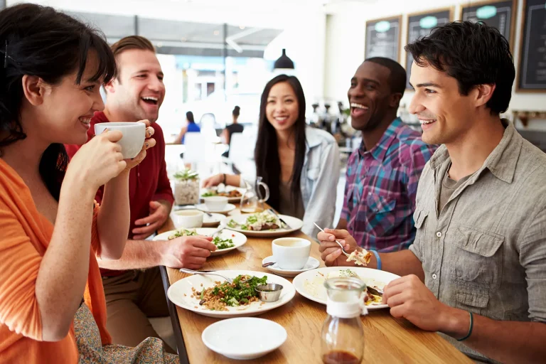 1800ss Getty Rf Young Friends Eating In Restaurant.jpg