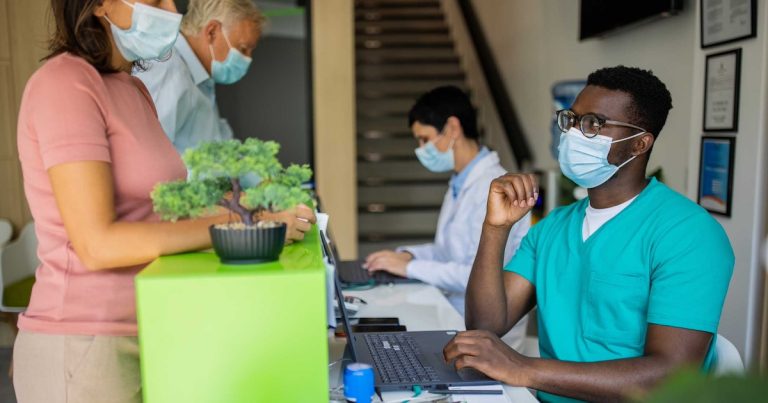 Healthcare Workers At Reception Area Mobi Getty Miodrag Ignjatovic Compressed.jpg