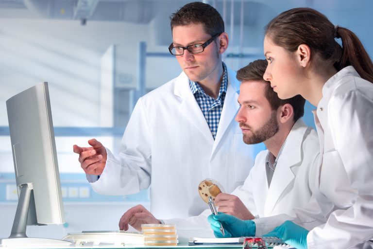 Researchers Looking At A Computer.jpg