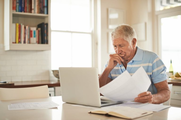 Stressed Person With Papers And Laptop 7uscv13.jpg