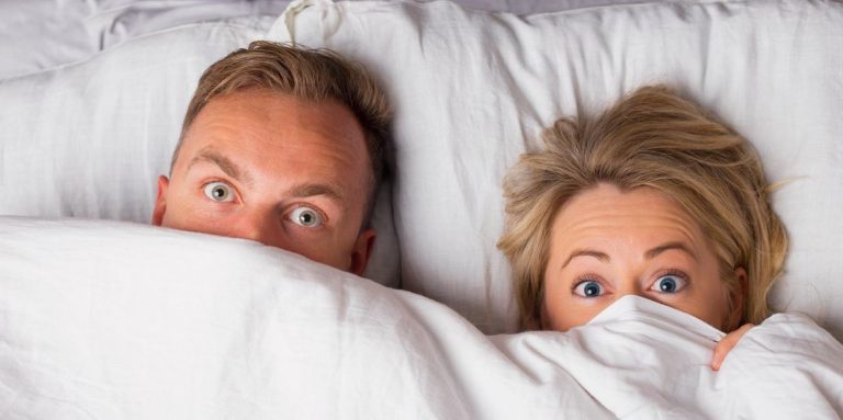 Couple Hiding Under Sheets.jpg