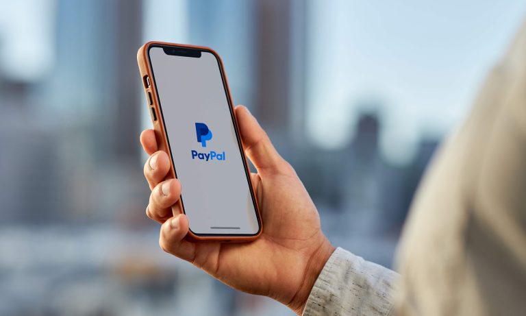 Person Holding Phone With Paypal App 1 Paypal.jpg