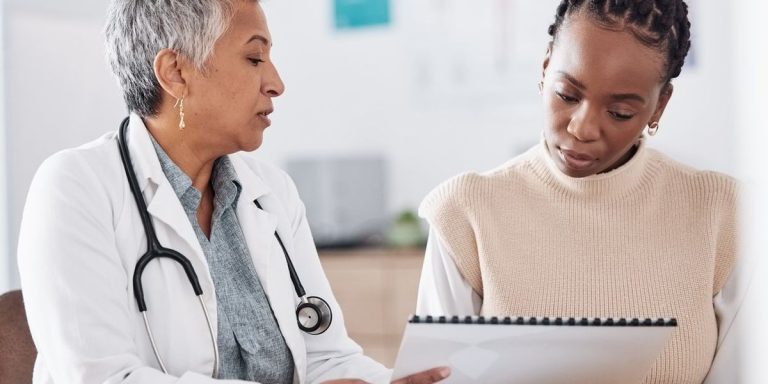 Doctor Consulting A Patient In Hospital For Healthcare History Or Record.jpg