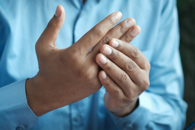 Person In Blue Shirt Showing Left Hand.jpg